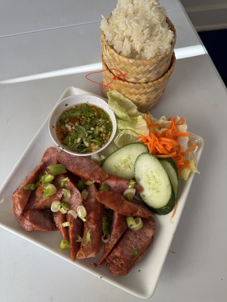 Thai sticky rice with spicy homemade pork sausage, cucumber and dipping sauce