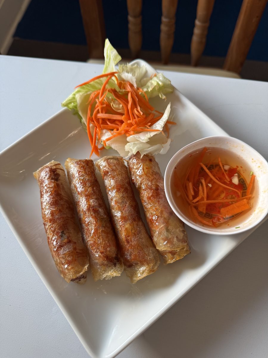 Four crispy Vietnamese eggrolls with dipping sauce